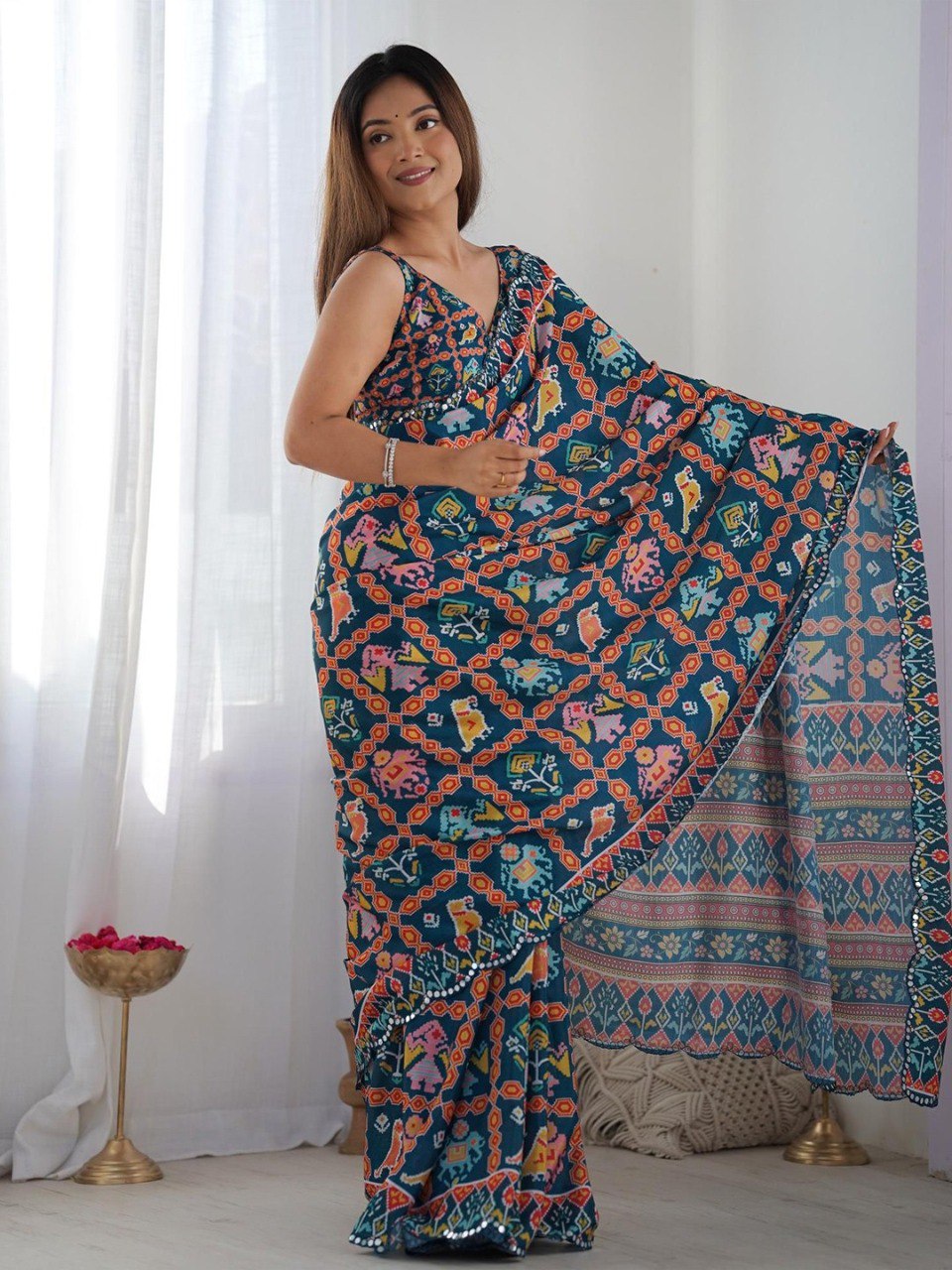 Navy blue color georgette saree with printed and mirror work border
