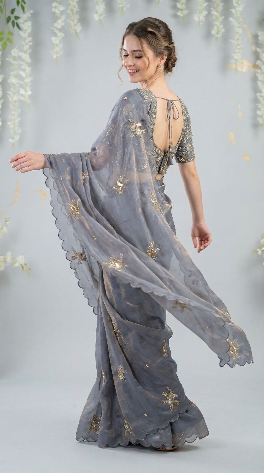 Gray fandy satin silk saree with heavy shine hand work and cutwork border.