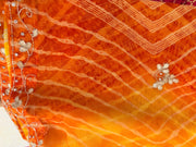 Close-up of cutdana border work on the yellow leheriya saree pallu