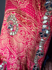 Pink ajrakh saree draped to show the embellished pallu
