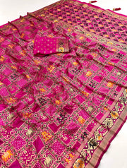 Rani pink patola silk saree with meenakari zari weaving work.
