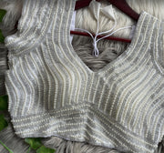 White soft silk readymade blouse with handcrafted pearl work.
