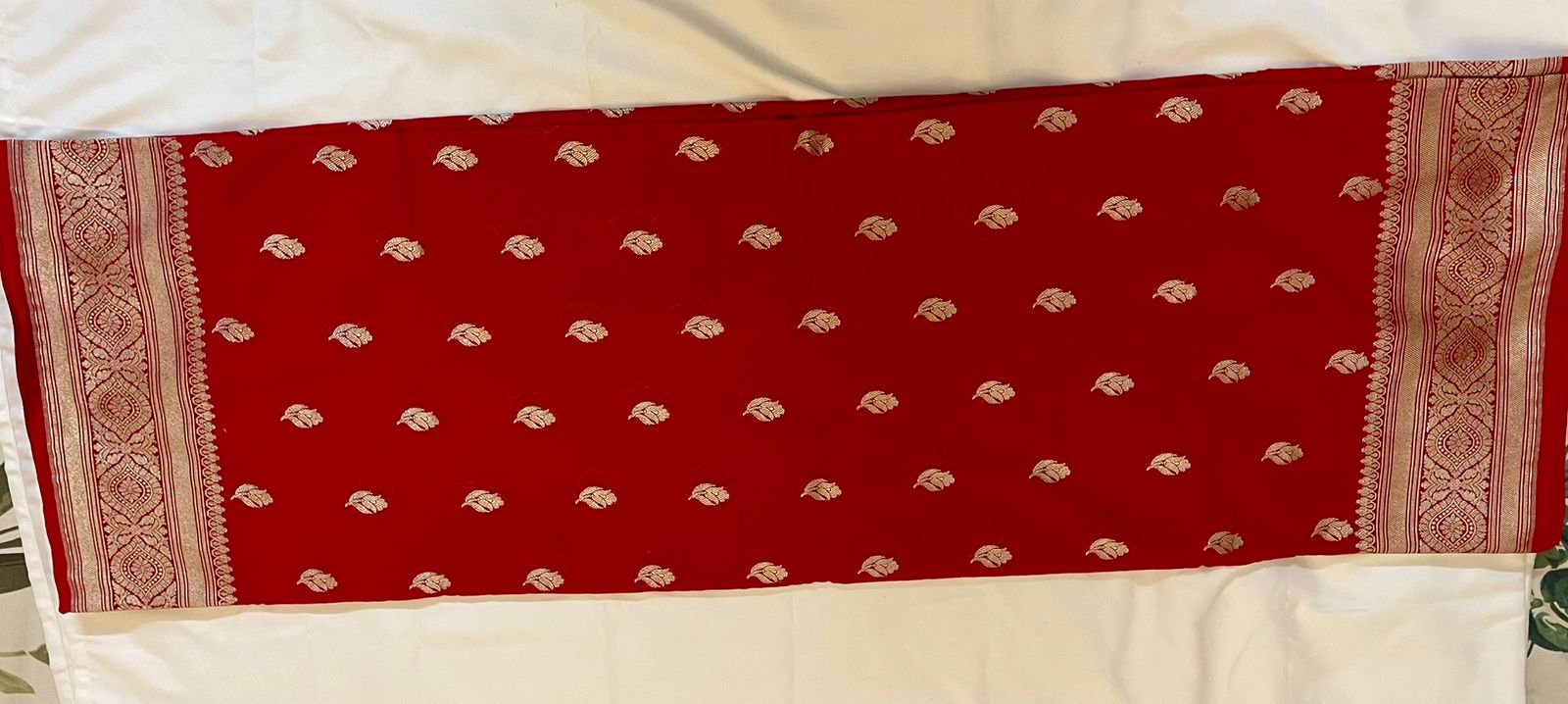 Pure Banarasi Khaddi Georgette Saree in Deep Red with Gold Zari Motifs.
