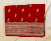 Pure Banarasi Khaddi Georgette Saree in Deep Red with Gold Zari Motifs.