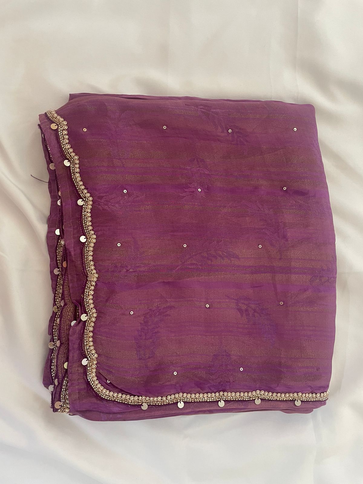 Purple Soft Silk Saree with Delicate Embellishments.