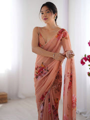 Peach color georgette saree with printed work and pearl border