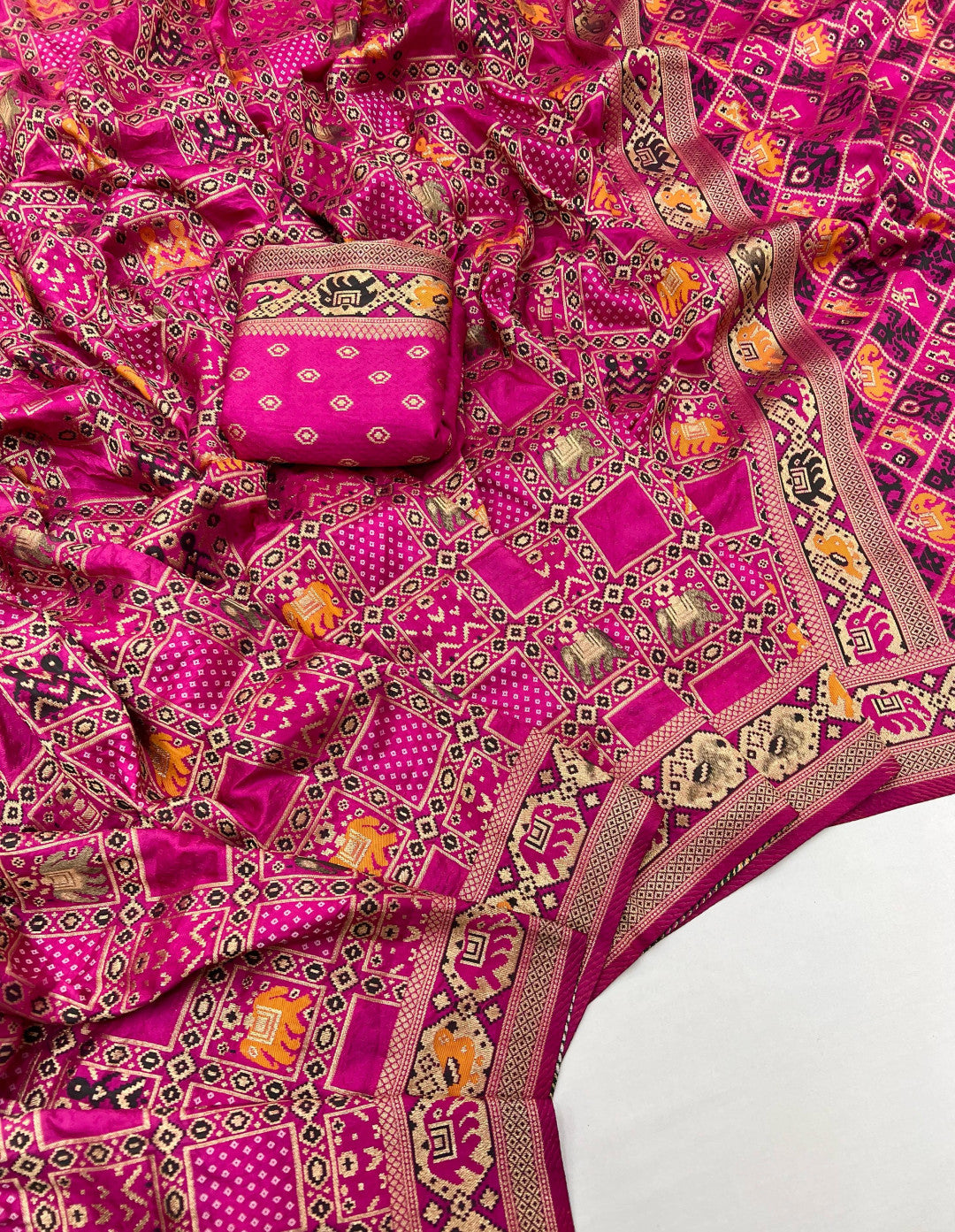 Rani pink patola silk saree with meenakari zari weaving work.