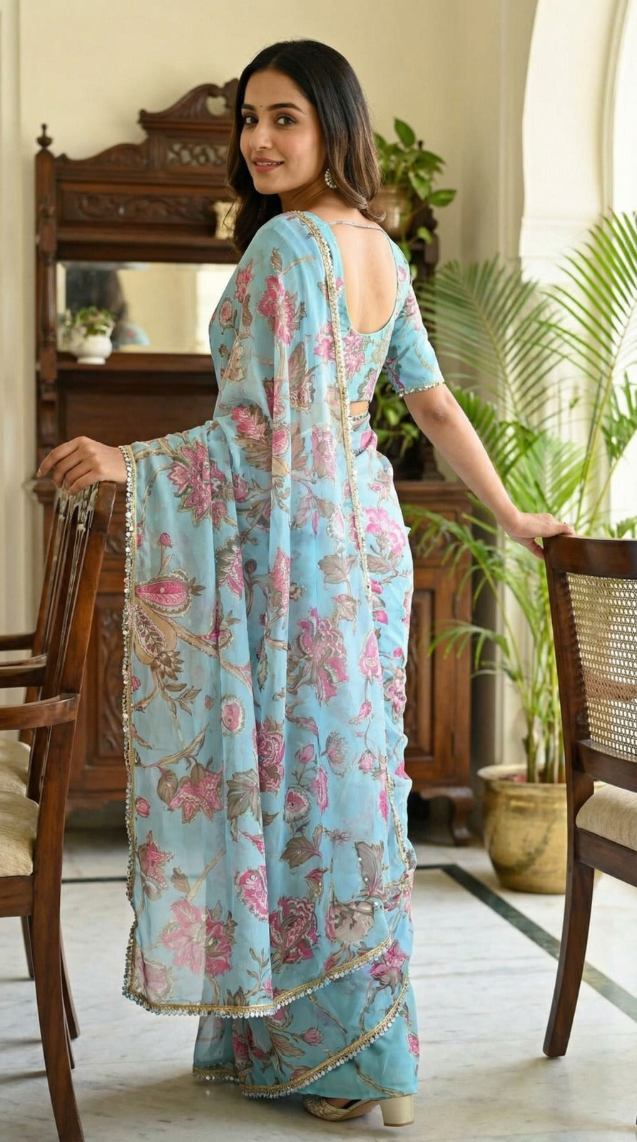 Sky blue georgette saree with Sequence work and mirror work border