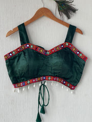 Dark green gajji silk readymade blouse with embroidery and mirror work.