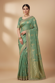 Pastel Green Saree with Gold Zari Motif and Lace Border.