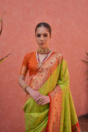 Parrot green premium banarasi silk paithani saree with zari weaving work.