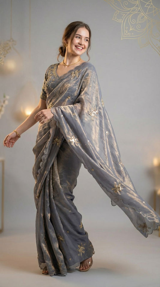 Gray fandy satin silk saree with heavy shine hand work and cutwork border.